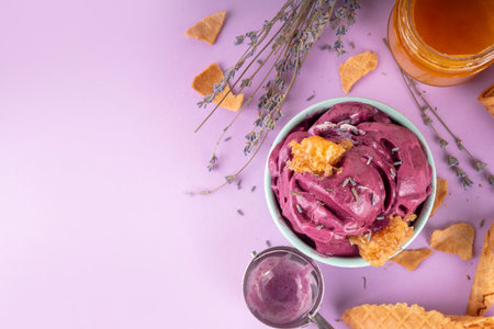Sweet lavender honey ice cream, creamy rich taste sorbet gelato with lavender flower and syrup, honey and honeycomb. Unusual artisanal lavandula ice cream recipe ideaの写真素材