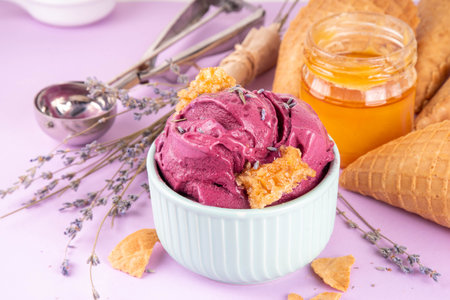 Sweet lavender honey ice cream, creamy rich taste sorbet gelato with lavender flower and syrup, honey and honeycomb. Unusual artisanal lavandula ice cream recipe ideaの写真素材