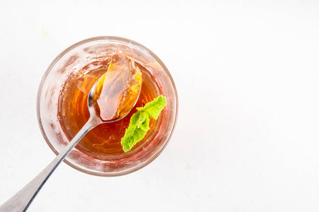 Black tea trendy asian dessert, diet non calorie sweet tea agar or gelatine jelly, in portioned glass, white table background copy spaceの写真素材