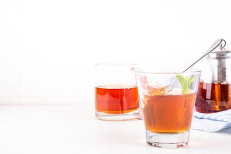 Black tea asian dessert, diet non calorie sweet tea agar or gelatine jelly, in portioned glass, white table background copy spaceの写真素材