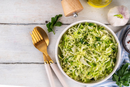 Spring cabbage salad, vegan healthy diet vegetable food, salad with spring cabbage, parsley, green onions, olive oil for dressingの写真素材