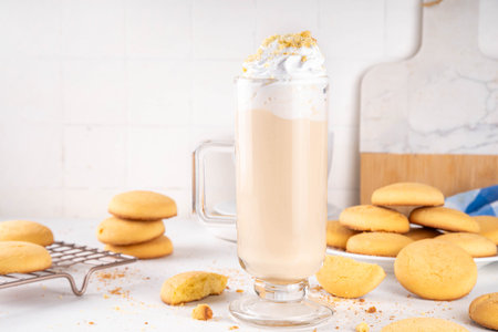 Shortbread sugar cookies milkshake, creamy shake drink with whipped cream and biscuits crumbsの写真素材