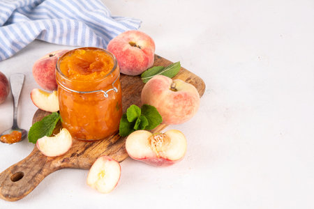 Flat chinese donuts fig peach jam, homemade confiture preserves with fresh fig peaches and mint in white background copy spaceの写真素材