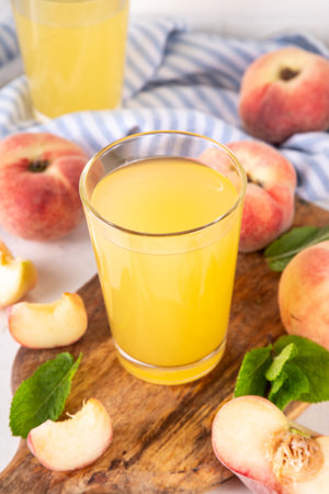 Flat chinese donuts fig peach juice with fresh fig peaches and mint in white background copy spaceの写真素材