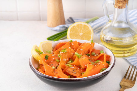 Viral trendy asian carrot salad with apple or wine vinegar, a little oil and salt, also known as Carrot Ribbon Salad. Trending carrot salad recipe, source of beta-carotene, healthy diet foodの写真素材