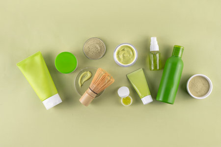 Matcha Skincare Cosmetics Background containing matcha powder, cream, serum, face mask, scrub, toner and moisturizer, natural clean beauty anti-aging skin care beauty trendの写真素材