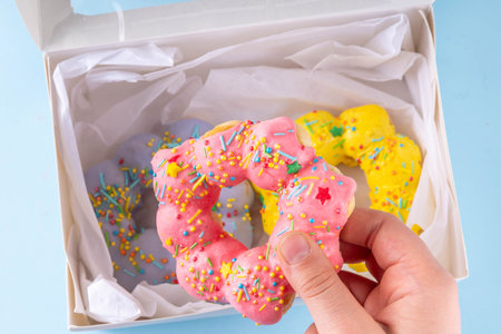 Asian trendy mochi donuts dessert. Sweet colorful mochi donuts baked pastry, with various toppings and fillingsの写真素材