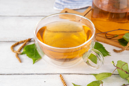 Natural organic birch tea. Herbal tea with leaves and blooming flowers with honey and pollen, organic hot detox healthy diet drinkの写真素材