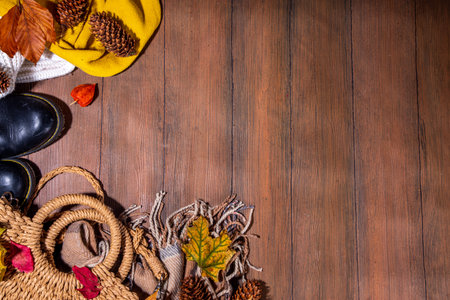 Preparation for fall and winter season, autumn cozy clothes and decor background, wooden table top view copy spaceの写真素材