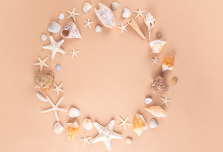 Simple minimal pattern background with seashells and starfish. Summer sale, holiday and travel background, border for sale, invitation, top view copy spaceの写真素材