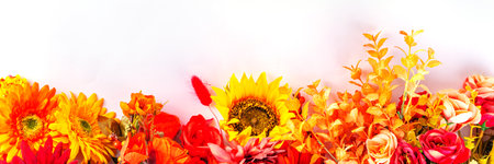 Autumn holidays greeting card background. Autumn red, orange, bright flowers and leaves a big bouquet on a background case. Teacher's Day, Thanksgiving Day, Halloween backgroundの写真素材