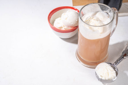 Ice cream beer floating cocktail, summer cold refreshment alcoholic drink, Root beer float in pint mug glass, copy spaceの写真素材