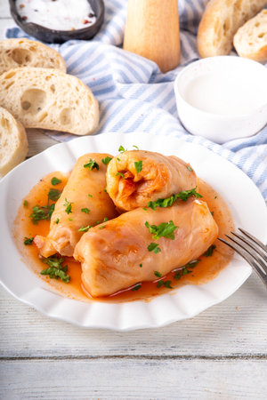 Comfort warm winter food, balanced Eastern European dinner recipe ideas, cabbage rolls, stuffed cabbage leaves, golubtsi with meat and vegetable fillingsの写真素材