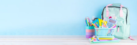 Back to school sale and shopping concept. Variety of school stationery in shopping basket pencils,...