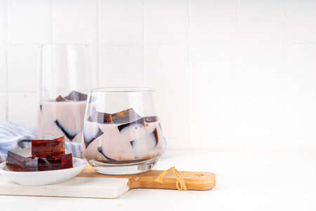 Homemade milky tea jelly, cold summer drink with black tea jelly and tea milk. Thai style iced cocktail, copy spaceの写真素材