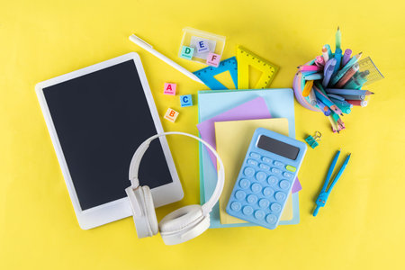 Back to school colorful background containing various school supplies, education accessories for...