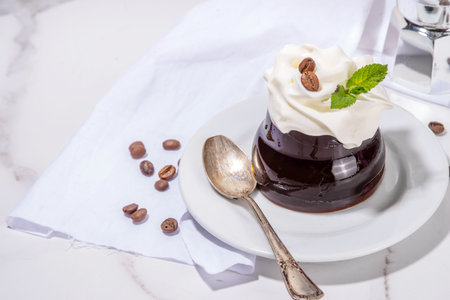 Coffee Jelly Dessert made with strong espresso coffee, gelatin or agar and whipped cream. Asian cold...