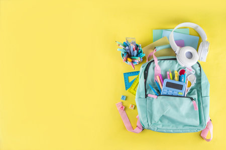 Back to school colorful background containing various school supplies, education accessories for...