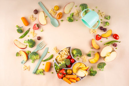 Baby finger food, various baby snacks, pasta, vegetables, fruits chopped for convenient, safe children's lunch, teaching small child to eat healthy foodの写真素材