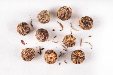 Tea Blossoms, dried Blooming Tea in glass cup on white table copy spaceの写真素材