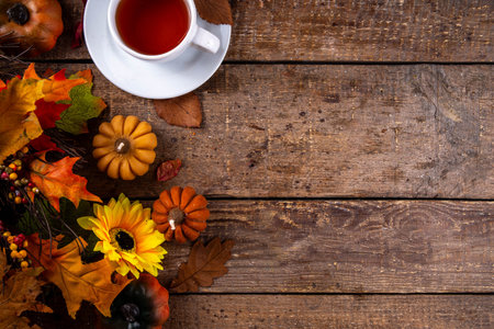 Cozy breakfast in fall season background, early autumn tea in garden, hot freshly baked brewed tea...