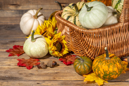 Autumn decorative pumpkins with fall leaves on wooden table background. Fall Thanksgiving halloween...