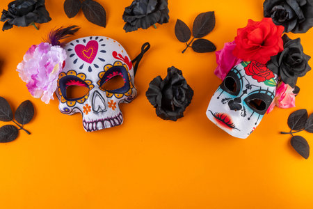 Dia de los muertos holiday background with black autumn flowers, and Mexican Day of the Dead masks....