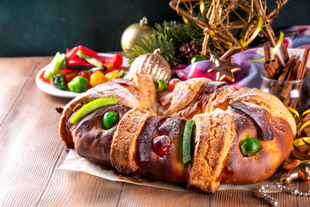 Traditional Mexican Rosca de Reyes, baking for January 6th in honor of DÃ­a de los Reyes Magos, Three Kings Bread, fruit flavored sweet bread for Christmas and  Kings Day festivitiesの写真素材
