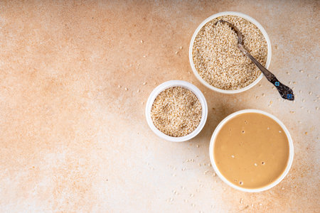Tahini with sesame seeds, oily sesame paste, source of healthy fats, snack or ingredient in Middle Eastern and Mediterranean foodsの写真素材