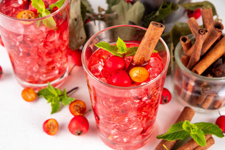 Sweet and sour fall seasonal alcohol hawthorn or rosehip cocktail, autumn berry mojito or margarita,...