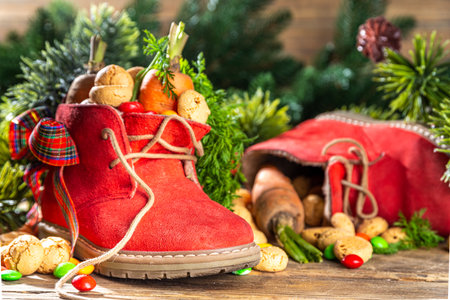 Sinterklaas, Saint Nicholas day background. Little kid red shoe with carrots and sweets, trooigoed,...