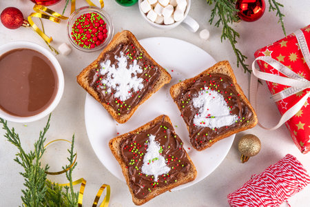 Christmas breakfast creative toast bread sandwiches for kids. Homemade Christmas morning sweet sandwiches made with chocolate paste, peanut butter, marshmallow and sugar powderの写真素材