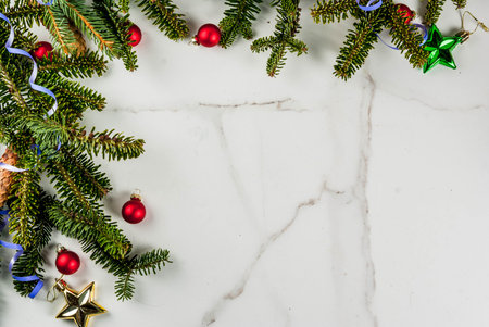 Christmas and New Year background with Christmas tree branches and traditional Christmas baubles, decorations and gifts, copy spaceの写真素材