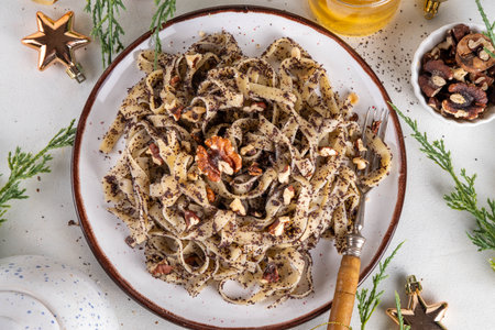 Poppy seed pasta, traditional east European food recipe. Egg noodles with poppy seed and nuts. Sweet tasty pasta, delicious idea for Christmas dinner on brunch, tasty dessert noodlesの写真素材