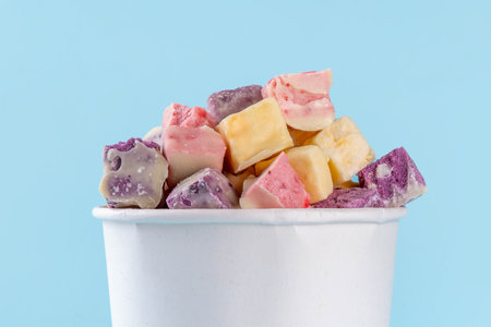 Colorful freeze dried yogurt with various fruit flavors. Homemade Frozen Dried Strawberry, Blueberry, Mango, Vanilla Yogurt Crunchの写真素材