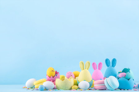Cute and bright pastel colored Easter eggs and bunny background. Pink. blue, yellow colored bunny...