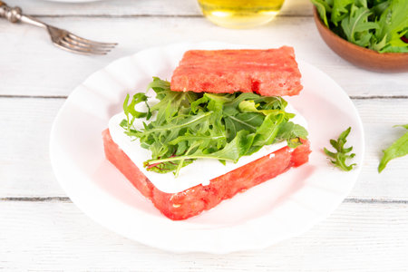 Viral watermelon sandwich burger with feta and arugula, summer picnic and bbq refreshment appetizer  food, on white kitchen table copy spaceの写真素材