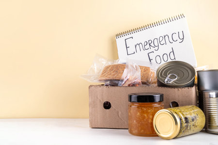 Emergency food kit. Non-perishable instant food, homemade Survival food set with in case of natural disasters, power outages, hazards, including canned goods, cereals, pasta, legumes, nuts, seedsの写真素材