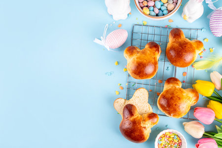 Sweet pastry idea for breakfast or snack on Easter holiday. Delicious glazed buns in rabbit bunny...