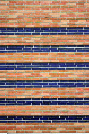 A brick wall in red and blue