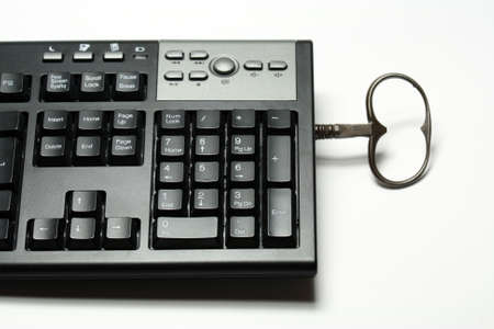A keyboard with an old keyの写真素材