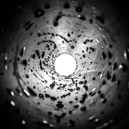 trumpet in droplets black white white circle at the end of the tunnelの写真素材