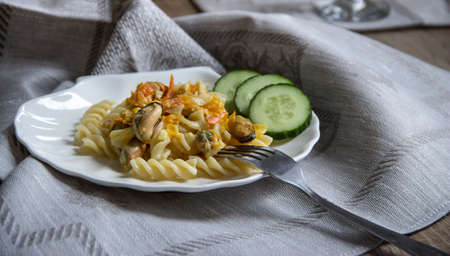 Plate with pasta and mussels fork napkinの写真素材