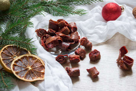 dried fruits strawberry berries pasta strawberries candied fruits on a table under a glass cap christmas tree bumps nuts tissue nutsの写真素材