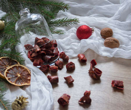 dried fruits strawberry berries pasta strawberries candied fruits on a table under a glass cap christmas tree bumps nuts tissue nutsの写真素材
