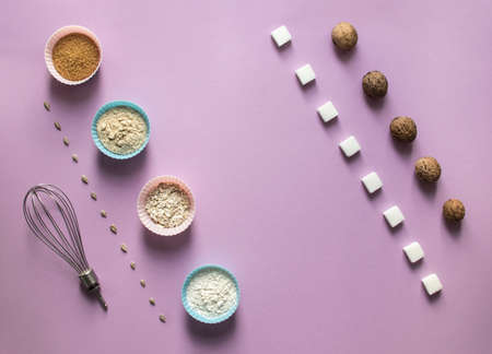 on a pink background diagonal layout sunflower seeds sugar cubes refined walnut walnut mold cupcake flour flakes corollaの写真素材