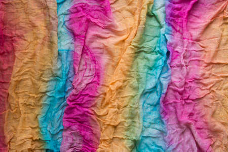 background multicolored scarf stole cloth wave rainbow chintzの写真素材