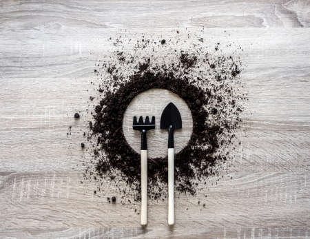 wooden background concept earth piled circle dish rake fork texture landing center spring horizontalの写真素材