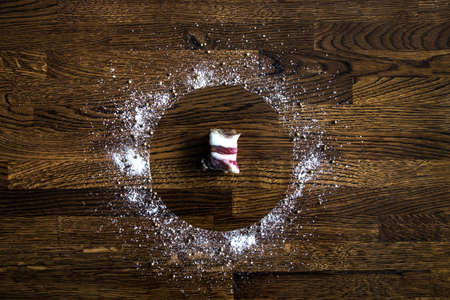 on a wooden background of cutlets of dark brown color circle sea salt large pepper seasoning...