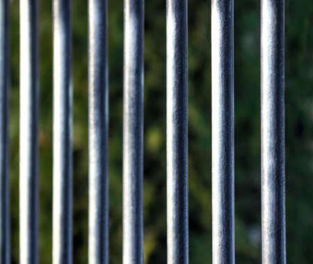 vertical grilles close up green trees blur backgroundの写真素材